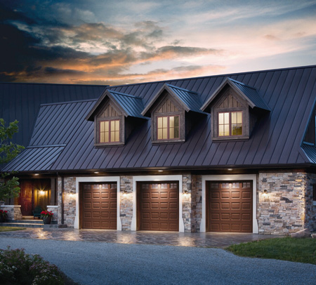 Clopay raised panel wood garage doors on 3 car garage