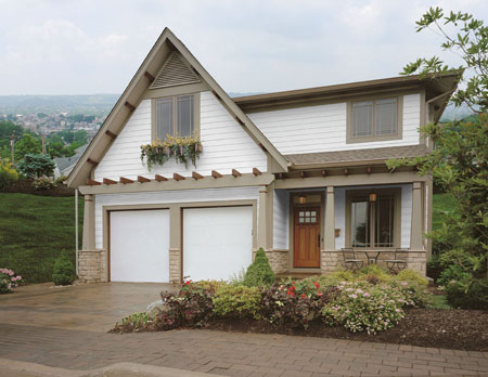 Residential home before new Clopay garage door upgrade