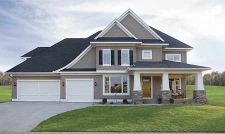 Residential home before upgraded with new Clopay garage door