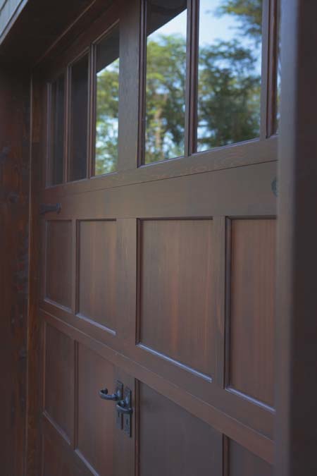 Close-up of a Clopay residential wood garage door.