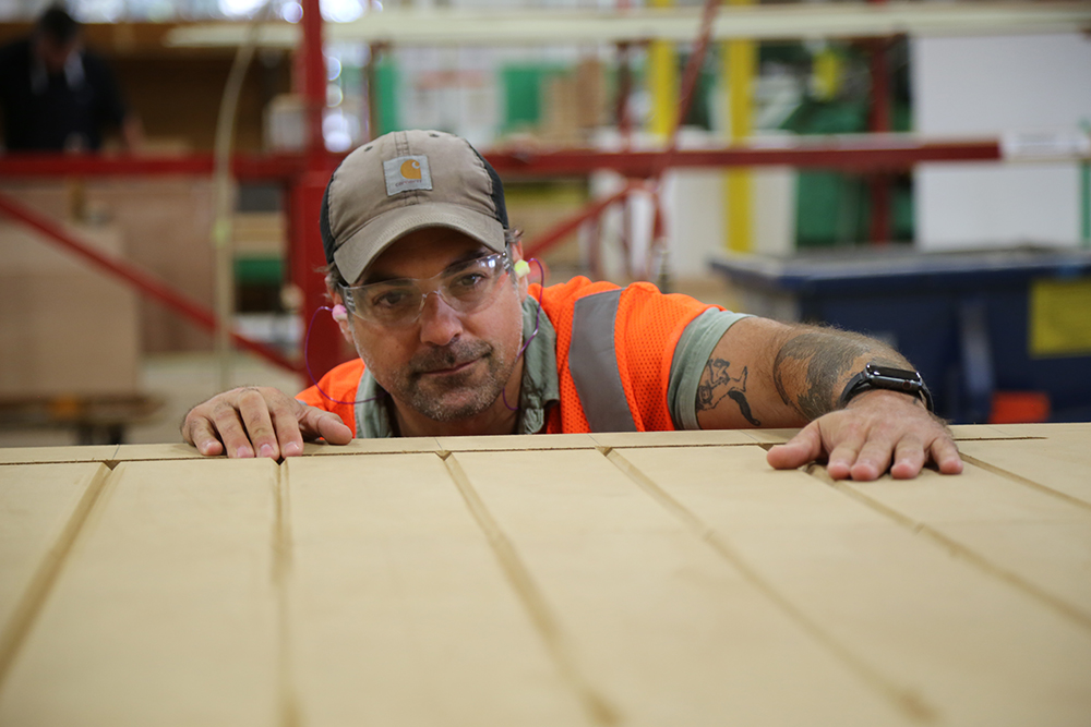 Anthony Carrino taking a close up look at his custom Clopay Garage Door