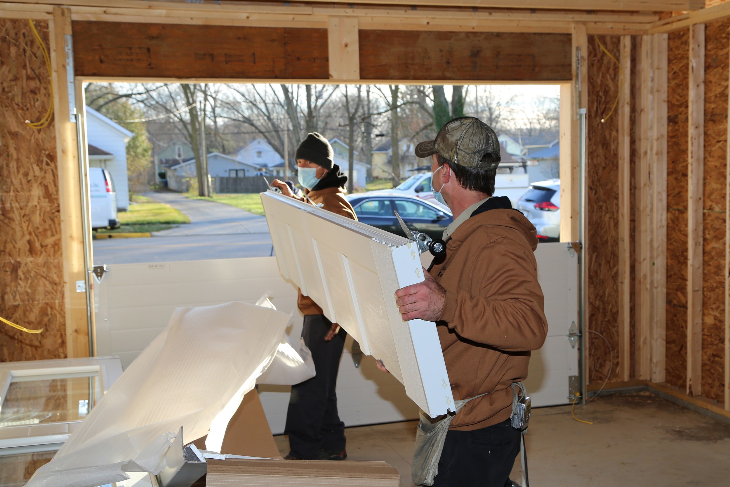 Installers from County Door with the Coachman Garage Door